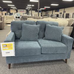 Loveseat By Ashley. 🚚WE DELIVER🚚