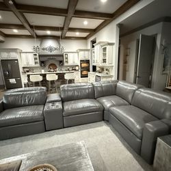 5 piece Gray Leather Power Reclining Sectional. Interchangeable pieces