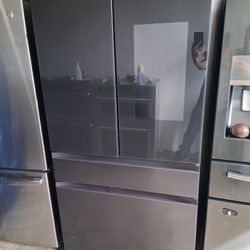 A Sanyo brand refrigerator with a screen 36 wide, by 68 and a half high and 24 deep, semi-new.