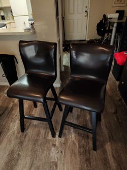 Two bar stools one of them almost perfect condition the other one had a little damage to it repaired it and I'm missing one of the little pieces down 