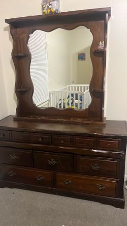 Brown dresser with mirror