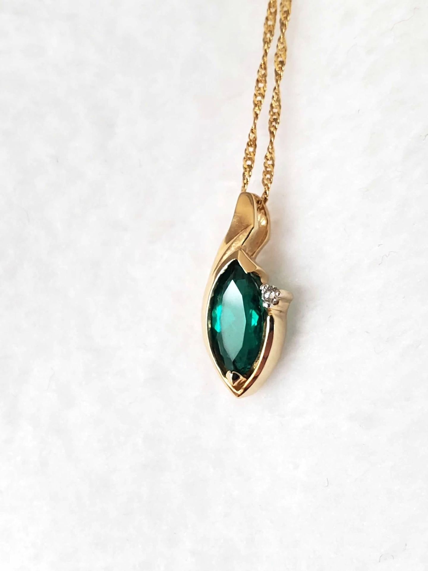 14k Yellow Gold Chain And Emerald Pendant With Diamond Accent