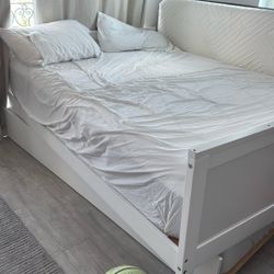 Queen Bed And A Desk And A Mattress 