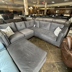 Grey Velvet Sectional And Ottoman 