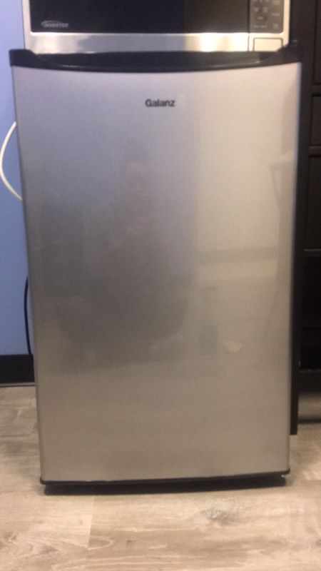 Tall Mini Fridge. Barely used. Price is firm,
