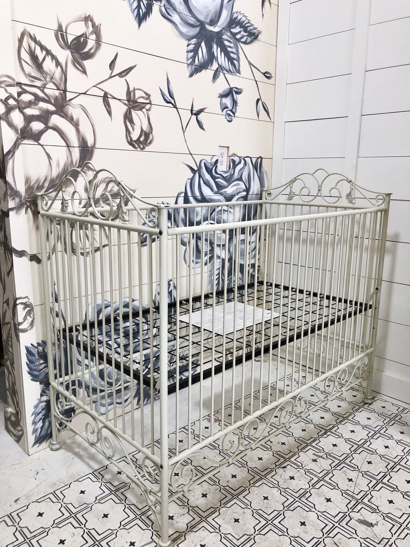 Iron crib by Bratt Decor in antique white with manufacturing distress
