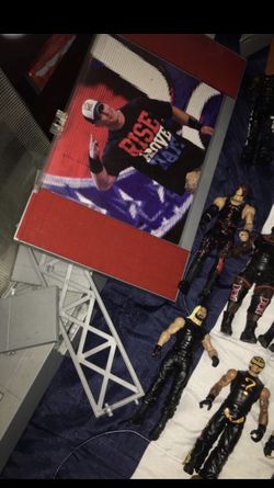 Wwe wrestlers and belts and stage