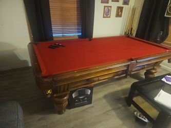 Slate Pool table with balls and a few sticks