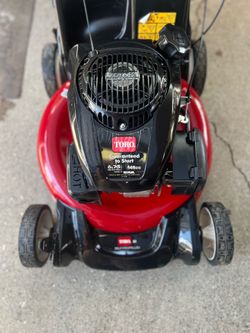 a Troy-Bilt 21-inch gas-powered push lawn mower