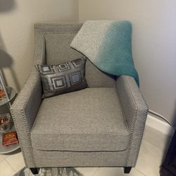 Two Gray Arm Chairs With Nail Head Trim