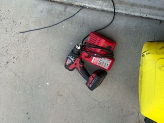 Milwaukee hammer  drill battery and charger