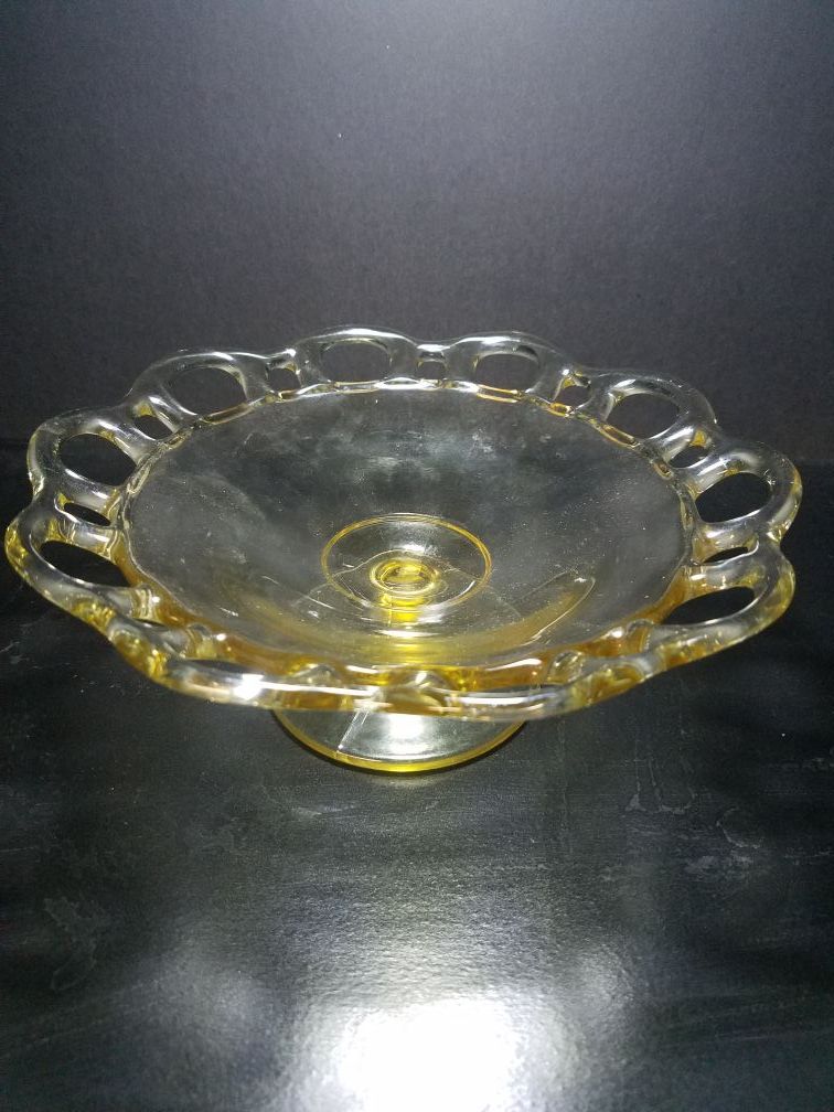 Vintage clear glass footed open lace dish.