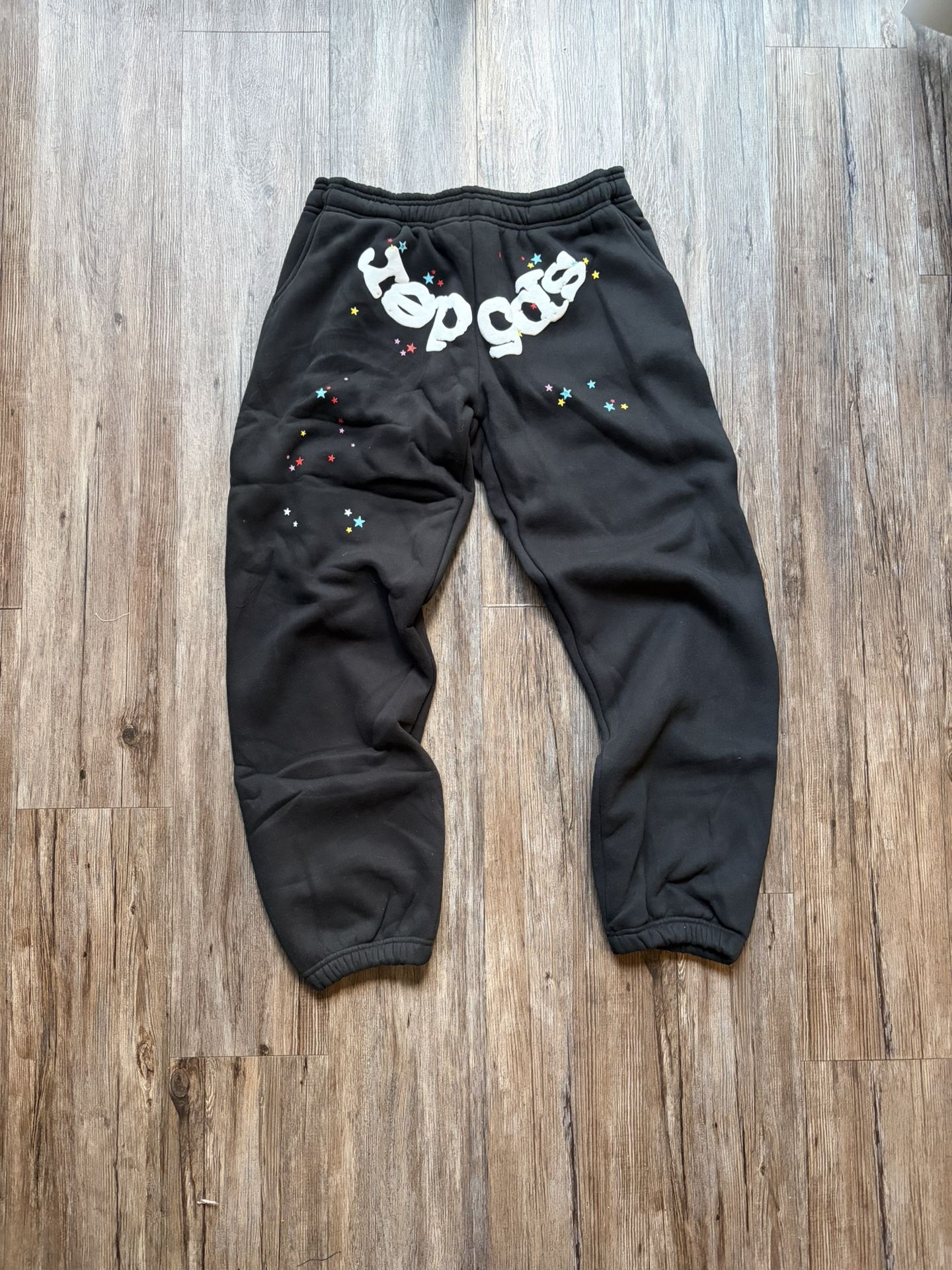 Black and multicolored spider sweats