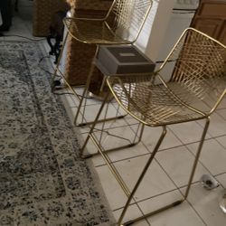 Two Tall Brass Chairs And A Small Brass Folding Table With A Sqayre Transparent Top