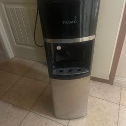Water dispenser PRIMO with two empty 5 gallon water bottles(pick Up And Cash Only)