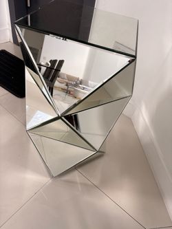 Mirrored side table with hourglasses