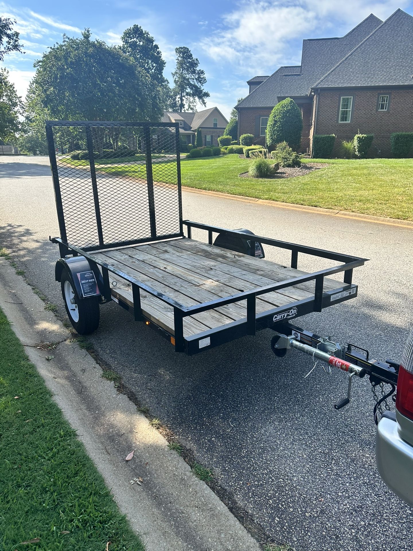 2023/5X8 UTILITY TRAILER WITH TREATED WOODEN FLOOR+ TITLE IN HAND .
