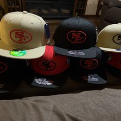 49ERS SF HATS WITH GOLD BLOODED AND HATER EMBLEM ALSO 49ERS EMBLEM 