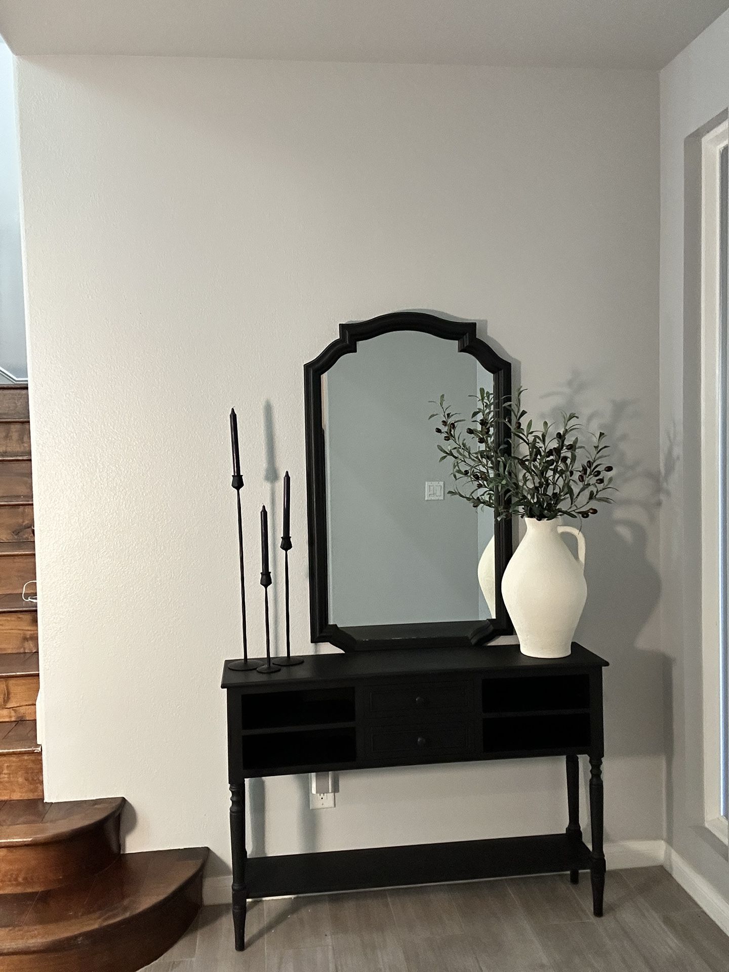 Black console table with mirror