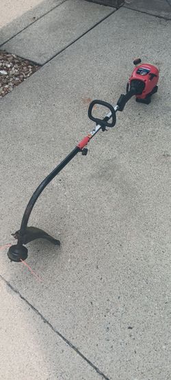 New carburetor lines tuned two-cycle Troy-Bilt weed wacker. 23 mile and Card Macomb Township Michigan $75 with trade-in or $90