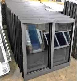 Gray Aluminum Sliding Window with Awning Panel