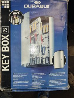 Durable Key Box 72, a wall-mounted brushed aluminum cabinet designed to securely store and organize up to 72 keys