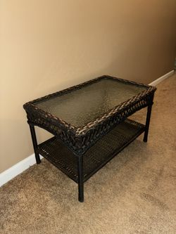 Wicker and Glass Patio Table.