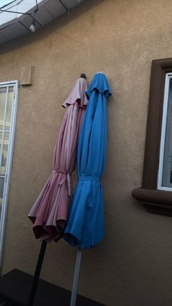 Two free umbrellas with stand