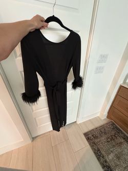 New Black Jumpsuit with feathered sleeves and rine stones on legs