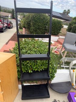2 black pottery barn wall shelves
