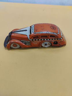 Vintage Louis Marx & Co. "Tricky Taxi" tin lithographed wind-up toy from the 1930s