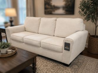 Free Delivery Today ! Ashley furniture couch with pullout bed . No stains. Pet free and smoke free. Nice !