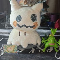 Pokémon pack Mimikyu plushie, Sceptiller figure, and Pokemon keychain