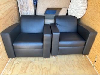 2 black leather Bernhard lounge chairs