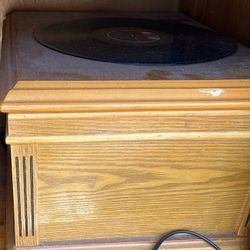 A Vinyl Record Player And Vinyl Records For Sale