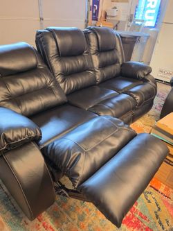 Black (leather) couches. 2 exact match