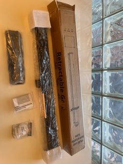 Black mesh retractable  gate