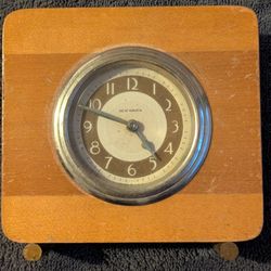 Vintage New Haven windup wood clock. Seems to run. Very cool little 4 inch mid-century modern decorative collectible clock. See my other items availab