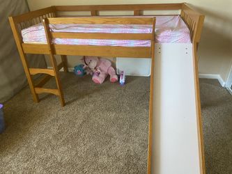 Bed with slide mattress included