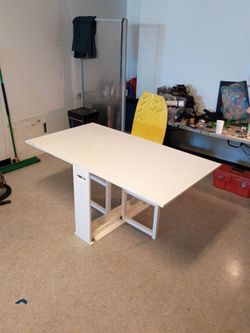 Solid wood folding table.