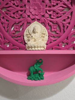 Carved wall shelf with Buddha and Elephant decor items