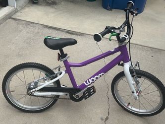 Woom 3 go 16 inch with auto magic 2 speed rear hub makes it easier for take off and general riding bike is the newer one with new style chainguard bik