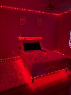 Pink bedframe with led lights and charging station