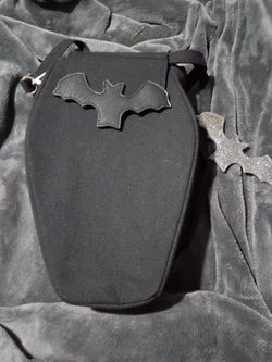Sweet Midnight Mini Coffin Bar Backpack/Crossbody. With interchangeable Bat emblem securely fastened to the front flap .