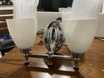 2 light fixture with 2 light bulbs.