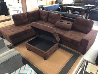 BRAND NEW REVERSIBLE SECTIONAL SOFA WITH STORAGE OTTOMAN AND CUP HOLDERS