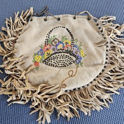 Antique Native American Beaded Floral Design leather bag. Fringed