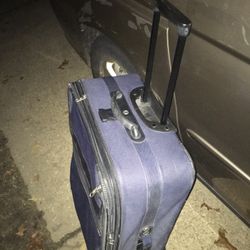 Nice large suitcase on wheels with extension handle only $35 firm serious inquiries only no time for games