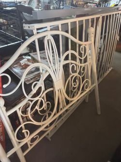 Twin white metal frame head and foot board . Lost the screws in the move you'll need your own so went from 100.00 to 40.00