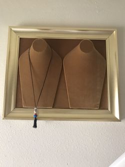 Beautiful gold velvet and gold frame jewelry wall display